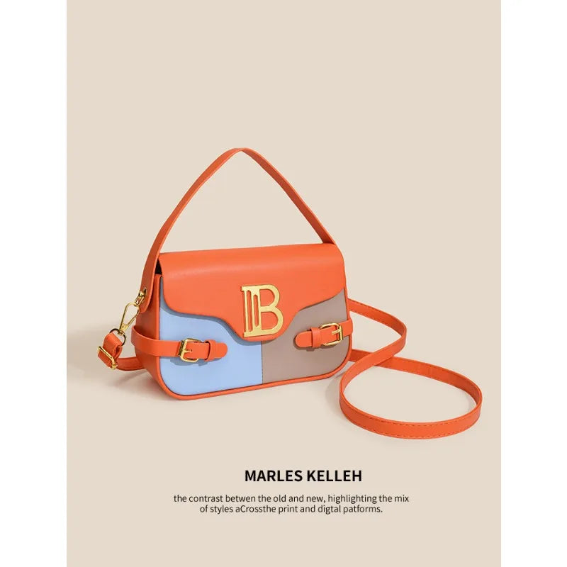 Luxury women's crossbody bag with color-blocking and stitching, box-style multi-color textured light luxury commuter bag.