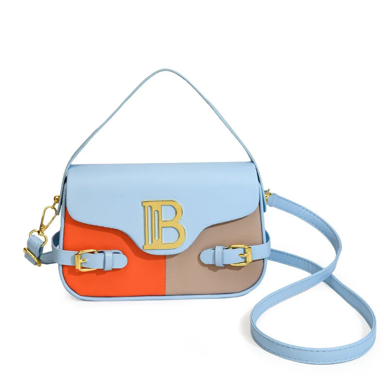 Luxury women's crossbody bag with color-blocking and stitching, box-style multi-color textured light luxury commuter bag.