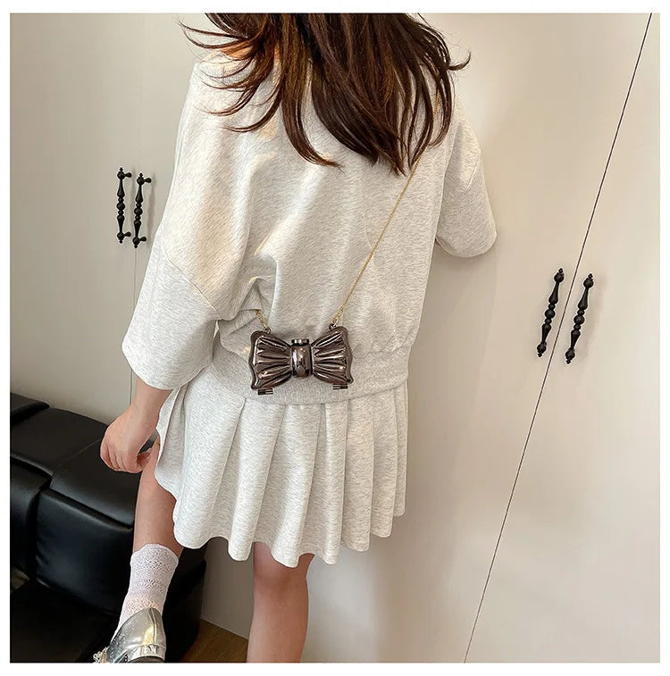 Luxury Fashion Metal Mini Handbag with Bow Clasp Playful Acrylic Bow Design with Shimmering European-Style Chain Crossbody Bag