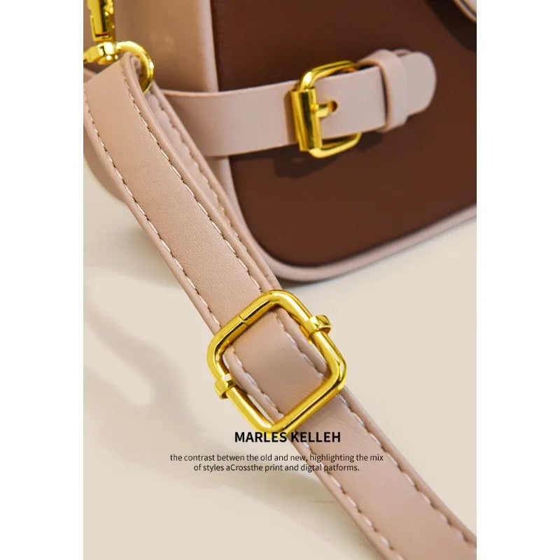 Luxury women's crossbody bag with color-blocking and stitching, box-style multi-color textured light luxury commuter bag.