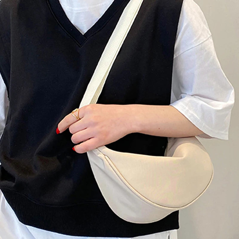 Women's bag - A round-shaped nylon bag with a cross-body strap, suitable for traveling, going to school or shopping.