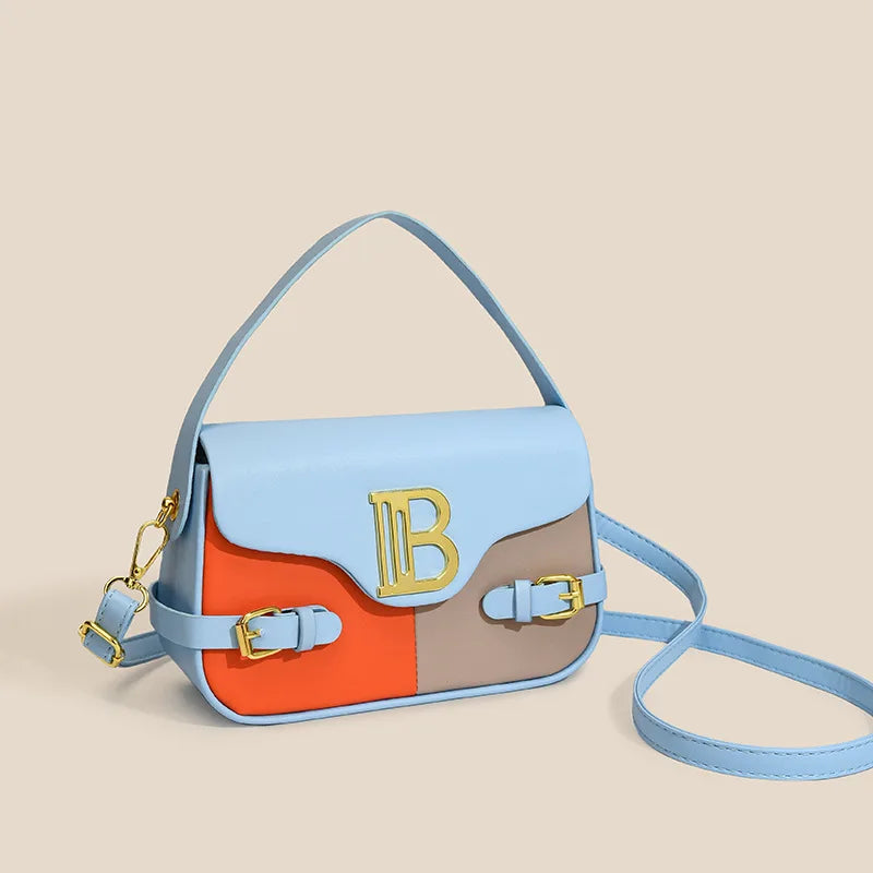 Luxury women's crossbody bag with color-blocking and stitching, box-style multi-color textured light luxury commuter bag.
