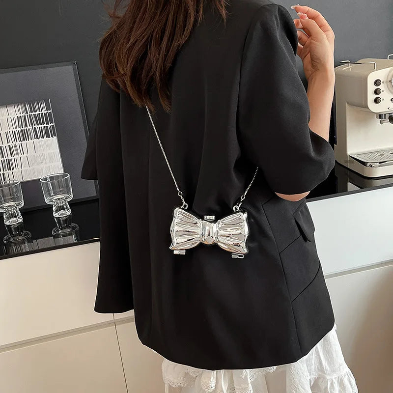 Luxury Fashion Metal Mini Handbag with Bow Clasp Playful Acrylic Bow Design with Shimmering European-Style Chain Crossbody Bag